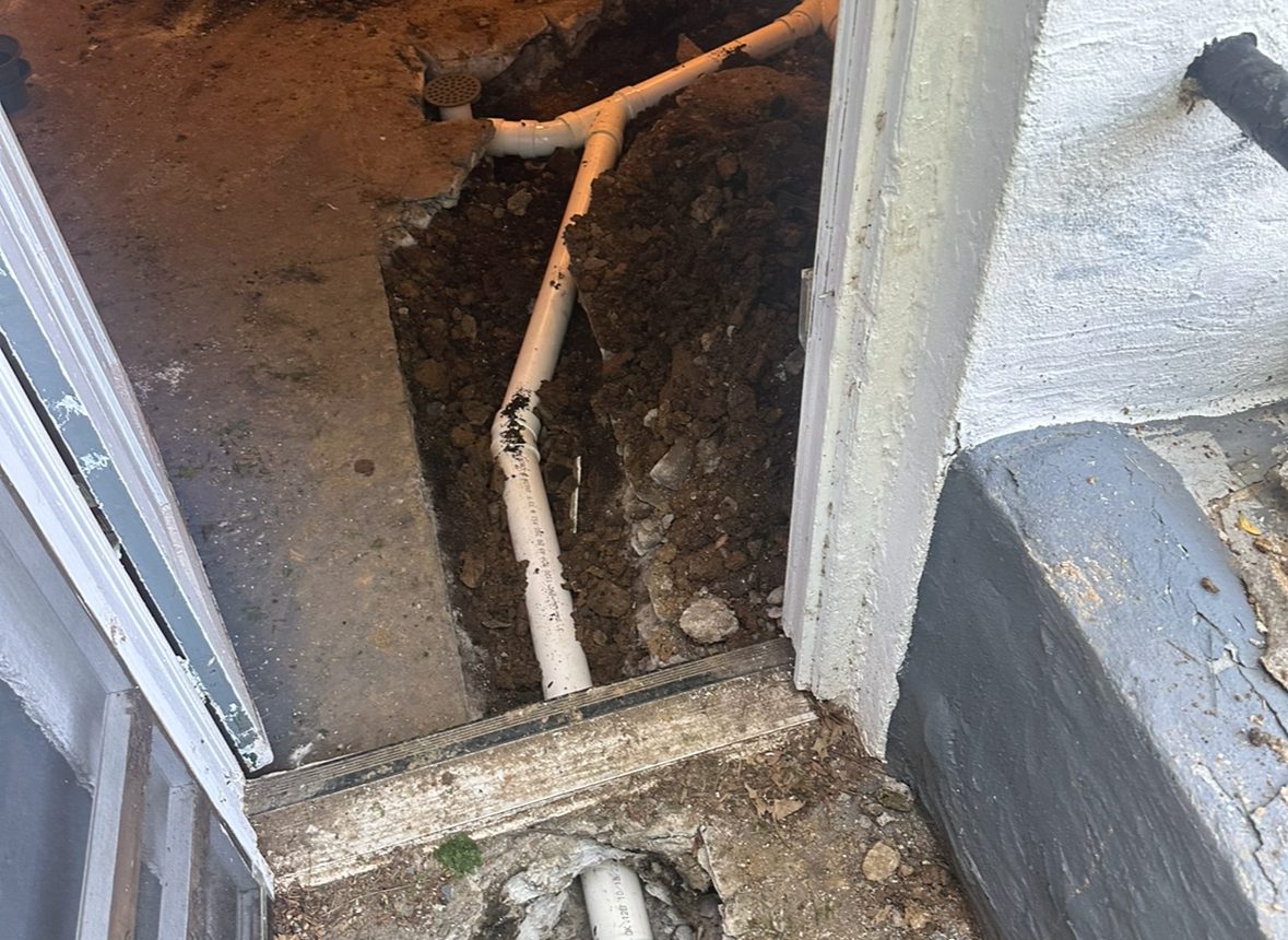 A view of the inside of a house with pipes.